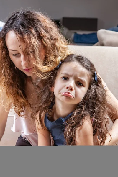 Portrait of mom and her sad daughter — Stock Photo, Image