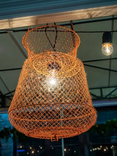 Lampshade for incandescent lamps from fishing cages, vintage style