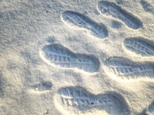foot prints in the snow. footprints of shoes in the snow