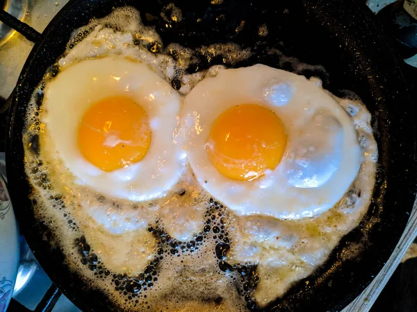 preparation of fried eggs. fried eggs in a pan