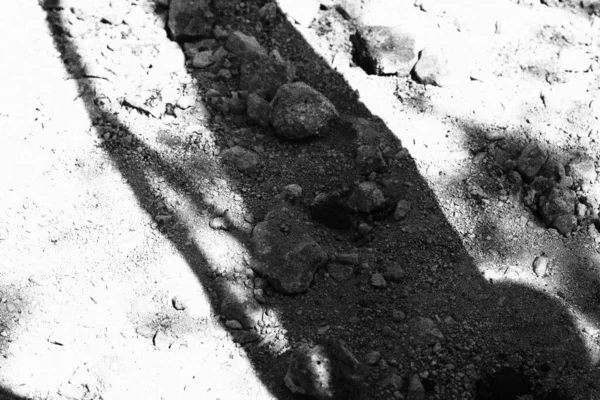 gray stones in the dust. stones of various shapes