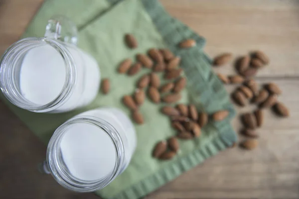 Two jars of almond milk — Stock Photo, Image