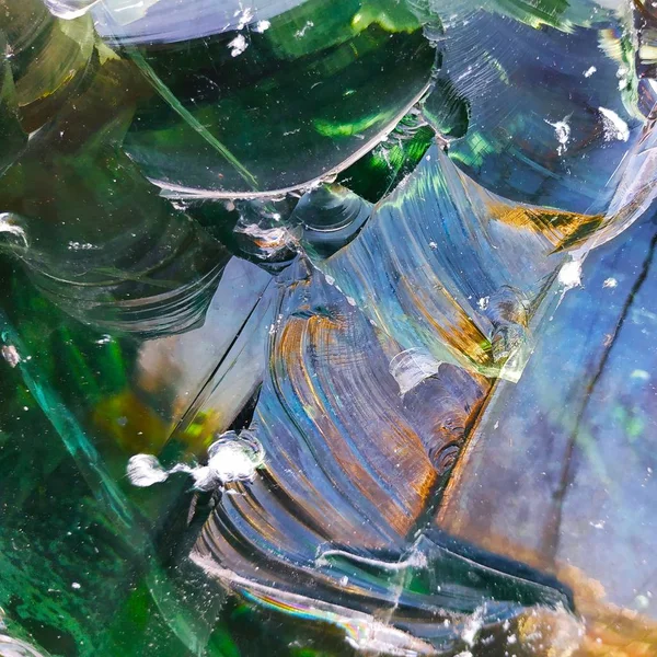 abstract illustration of broken bottle glass in green shades