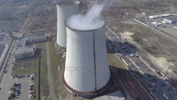 Flying over the plant producing thermal energy with large pipes Aerial. — Stock Video
