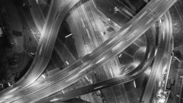 Traffic on freeway interchange. Aerial night view timelapse city traffic. — Stock Video