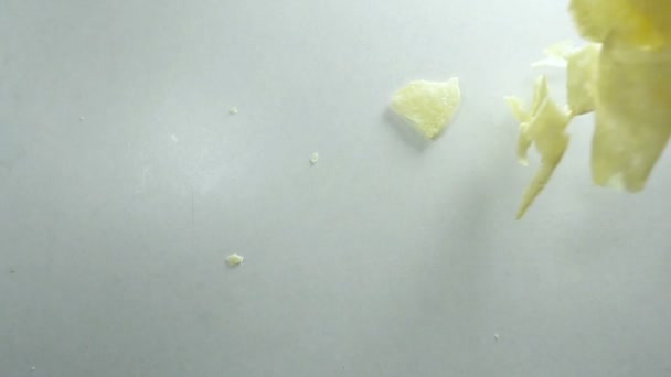 Falling Potato Chips against white background. Shot with high speed camera in slow motion. — Stock Video