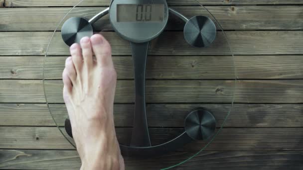 Very Heavy Man Stepping on the Bathroom Scale. 3840X2160 UHD video — Stock Video