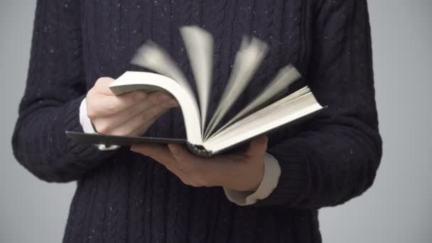 Womans hands holding a black book, close-up — Stock Video