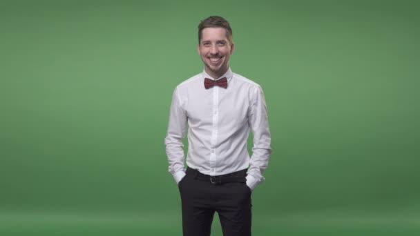 Man in a white shirt with a bow-tie and black pants — Stock Video