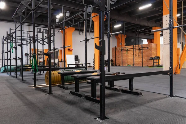 Interior of gym for fitness training with horizontal bar and barbells — Stock Photo, Image