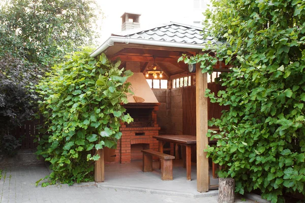 Cozy wooden gazebo Stock Photo