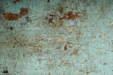 Eski bir ahşap yüzey üzerinde mavi boya kırık