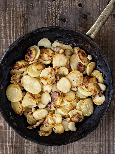 Rustic german bratkartofflen fried potatoes — Stock Photo, Image