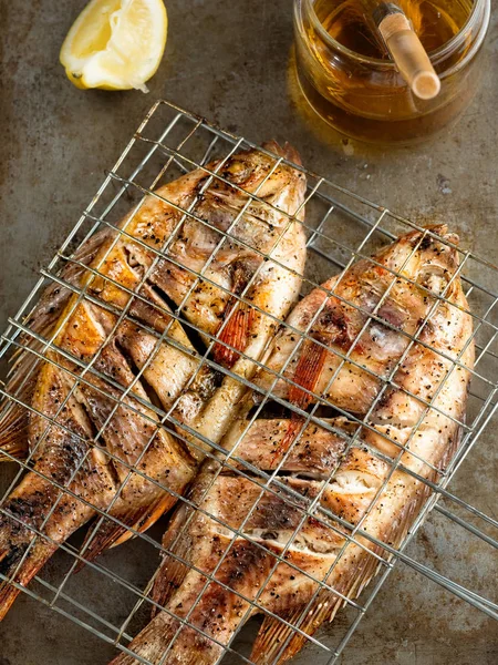 Rustic barbecued grilled fish — Stock Photo, Image