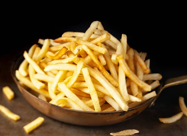 Pan of rustic golden french fries — Stock Photo, Image