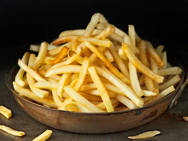 Pan of rustic golden french fries — Stock Photo, Image