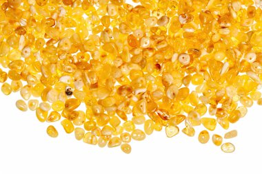 Beyaz zemin üzerine sarı kehribar taşı. 