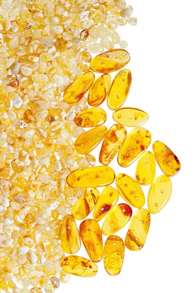 Yellow amber stones on a white background. — Stock Photo, Image