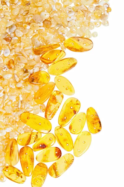 Yellow amber stones on a white background. — Stock Photo, Image