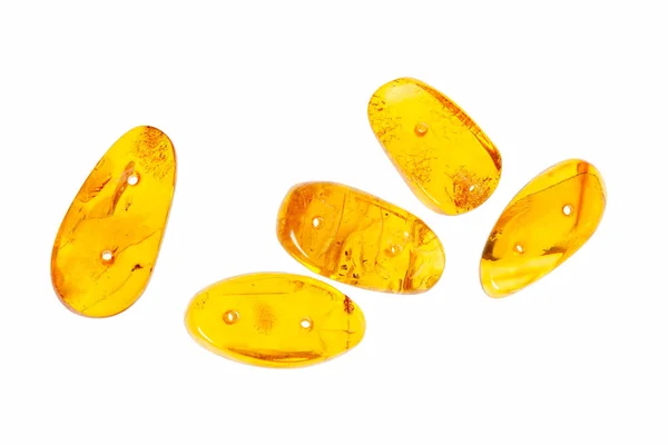 Beyaz zemin üzerine sarı kehribar taşı. 