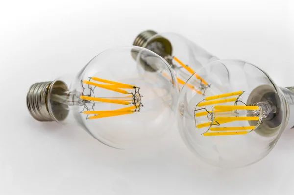 Tree various LED filament light bulbs wits a E27 base — Stock Photo, Image