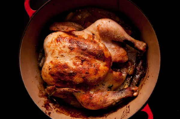 coconut whole chicken in a dutch oven