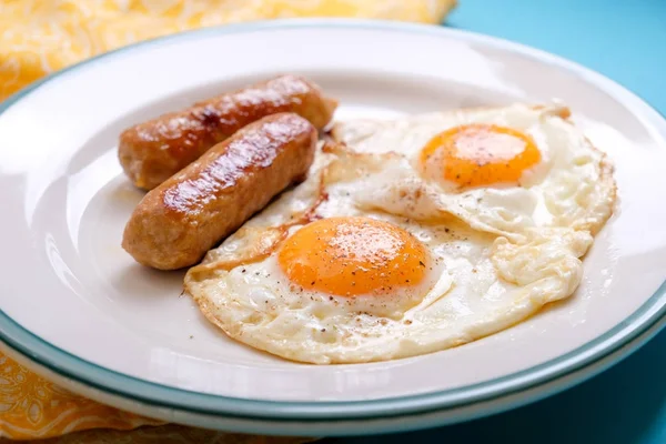 sunny side up orgamic egss with sausages