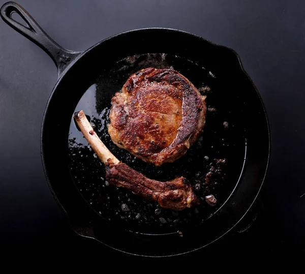 cast iron pan seared rib steak off the bone