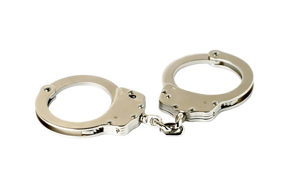 Steel handcuffs on a white — Stock Photo, Image