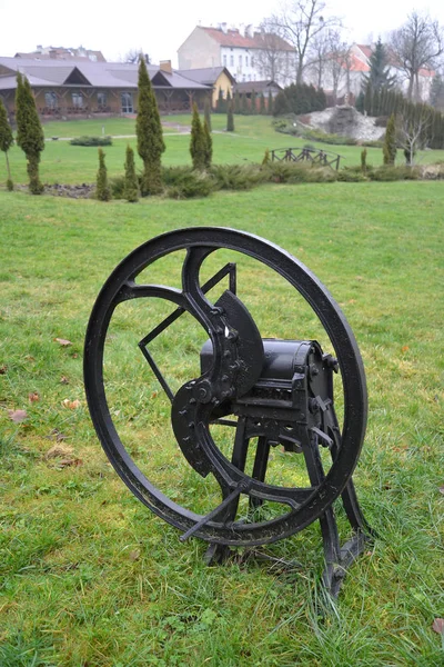 The agricultural mechanical grinder lies on a grass — Stock Photo, Image