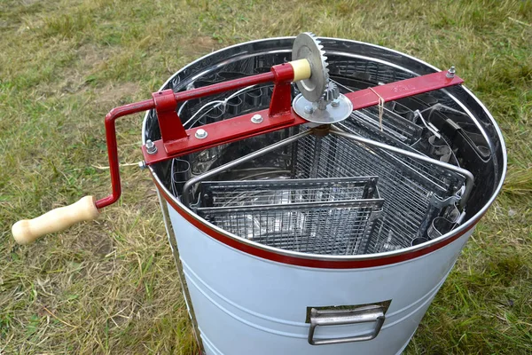 Universal hordialny radial honey extractor  against the background of a grass — Stock Photo, Image