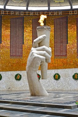 VOLGOGRAD, RUSSIA - APRIL 23, 2017: An eternal flame in the Hall of Military glory clipart