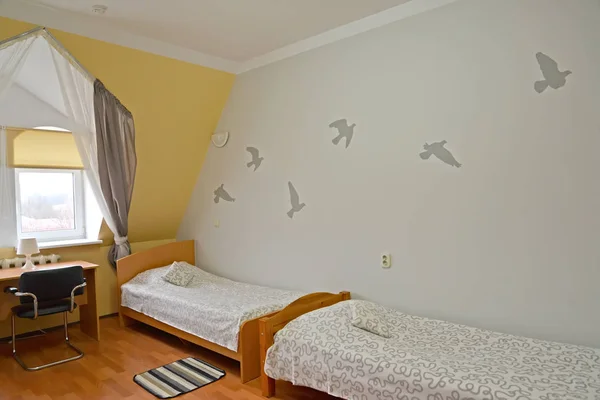 Fragment of an interior of the double hotel room with painting on a wall — Stock Photo, Image