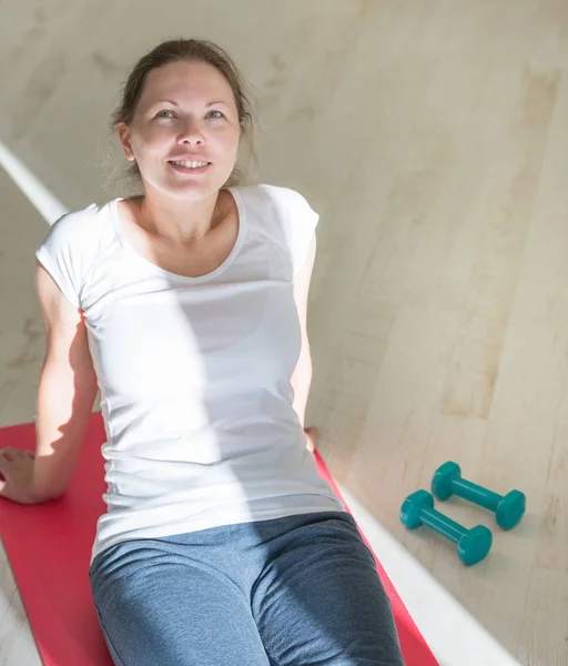 portrait of young obese woman working out home