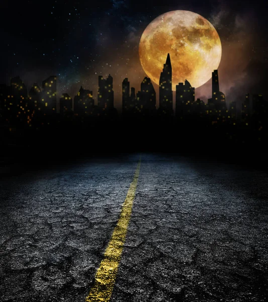City lights in night and old road with full moon — Stockfoto