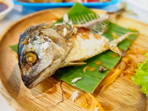 Fried mackerel fish on wooden dish — Stock Photo, Image