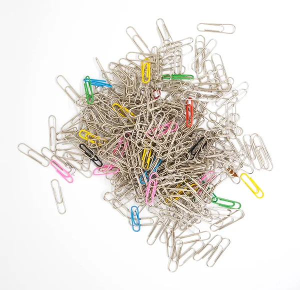 Pile of metal paperclips isolated — Stock Photo, Image