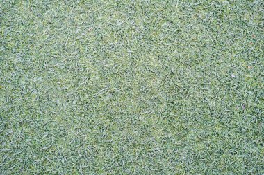 Sahte yeşil çim çim yüzey dokusunu arka plan