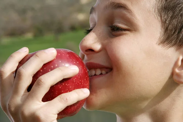 Appetizing, apple eating, young man — Stock Photo, Image