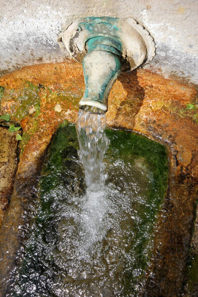 Stone fountain mountain water