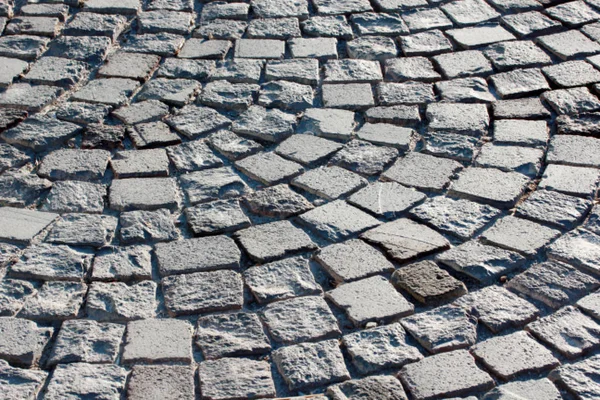Modern gray cobblestone road pavement