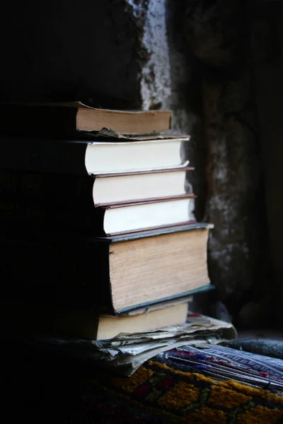 old and new books inside the room