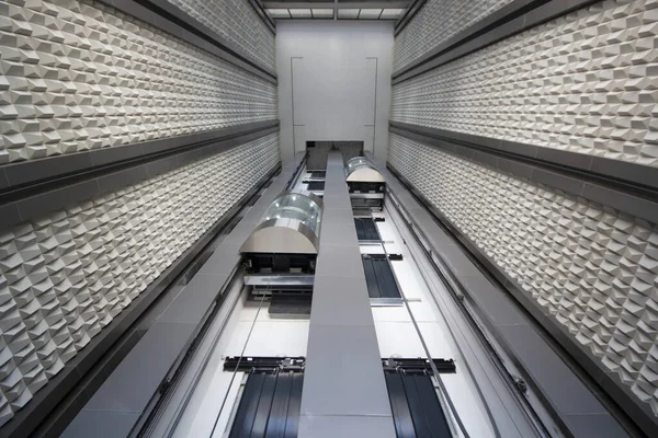 Inside a modern elevator shaft.