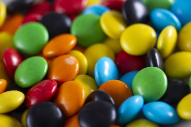 Gökkuşağı renkli şekerler, çok renkli yakın plan, doku, arkaplan.