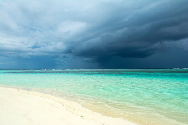 Cloudy landscape of Indian ocean sandy beach  before the storm
