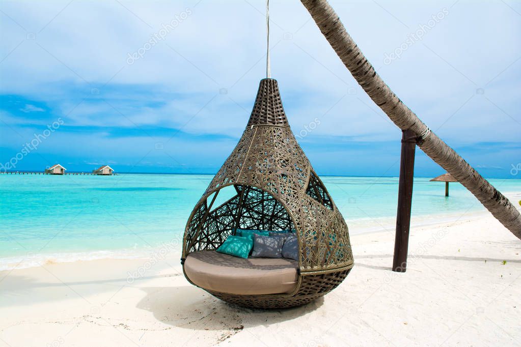 Chill lounge zone on the sandy beach, Maldives island 