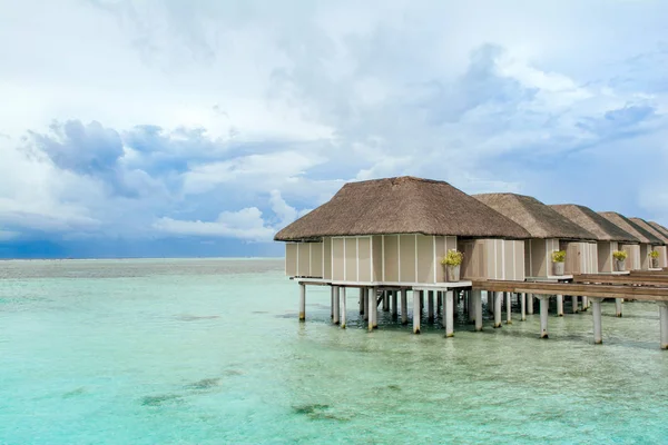 Wooden villas over water of the Indian Ocean, Maldives