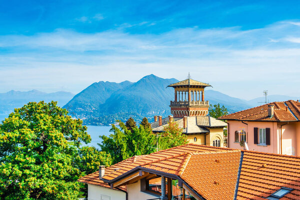 Stresa, Italy - 12 October 2019: Beautiful old style building in Stresa with view to mountain and Lago Maggiore lake