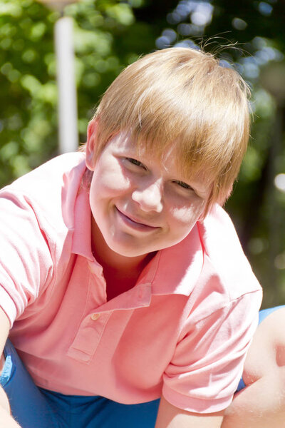 Portrait of blond boy in sunlight