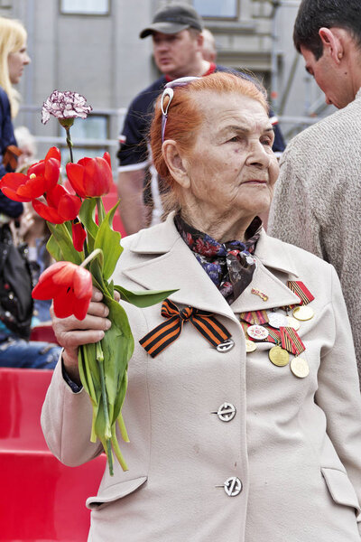Woman is Russian veteran on celebration at the parade annual Vic